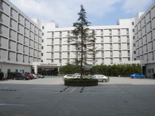 Шанхай Китай код скидки на ваучер на отель agoda.com